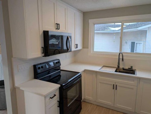 528 Queensland Place Se, Calgary, AB - Indoor Photo Showing Kitchen