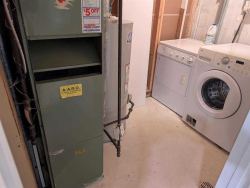 528 Queensland Place Se, Calgary, AB - Indoor Photo Showing Laundry Room
