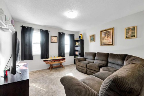 2 Saddleland Way Ne, Calgary, AB - Indoor Photo Showing Living Room