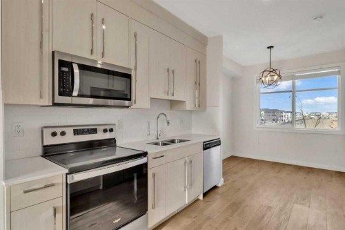 6323 128 Avenue Ne, Calgary, AB - Indoor Photo Showing Kitchen With Stainless Steel Kitchen With Double Sink With Upgraded Kitchen