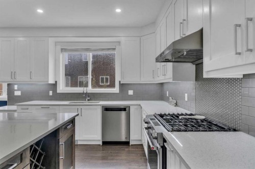 205 Kinniburgh Cove, Chestermere, AB - Indoor Photo Showing Kitchen With Stainless Steel Kitchen With Upgraded Kitchen