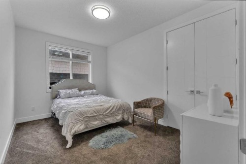 205 Kinniburgh Cove, Chestermere, AB - Indoor Photo Showing Bedroom