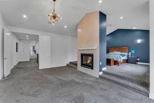 205 Kinniburgh Cove, Chestermere, AB - Indoor With Fireplace