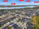 205 Kinniburgh Cove, Chestermere, AB  - Outdoor With Body Of Water With View 
