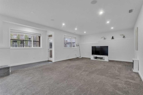 205 Kinniburgh Cove, Chestermere, AB - Indoor Photo Showing Other Room