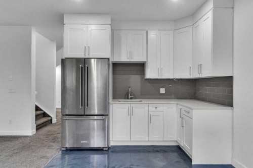 205 Kinniburgh Cove, Chestermere, AB - Indoor Photo Showing Kitchen