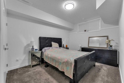 205 Kinniburgh Cove, Chestermere, AB - Indoor Photo Showing Bedroom