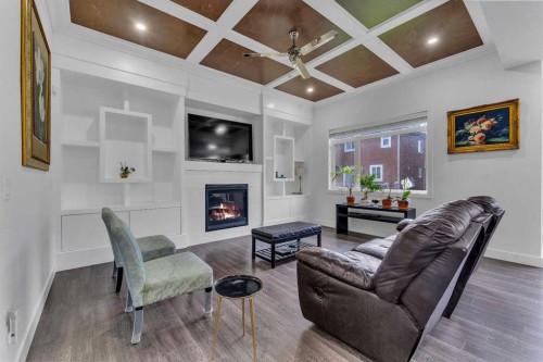 205 Kinniburgh Cove, Chestermere, AB - Indoor Photo Showing Living Room With Fireplace