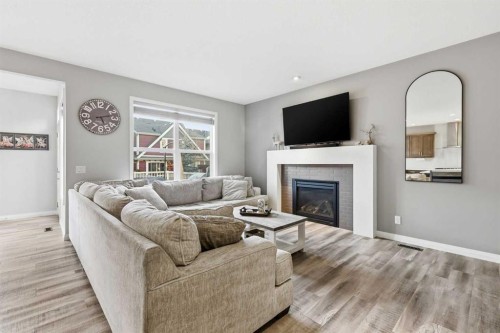 10 Riviera Place, Cochrane, AB - Indoor Photo Showing Living Room With Fireplace