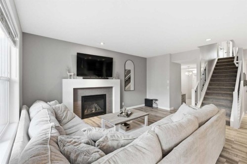 10 Riviera Place, Cochrane, AB - Indoor Photo Showing Living Room With Fireplace