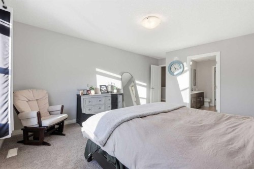 10 Riviera Place, Cochrane, AB - Indoor Photo Showing Bedroom