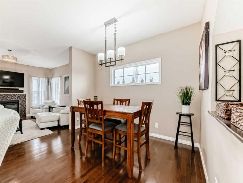 301 Kincora Glen Rise Nw, Calgary, AB - Indoor Photo Showing Dining Room With Fireplace