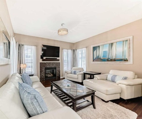 301 Kincora Glen Rise Nw, Calgary, AB - Indoor Photo Showing Living Room With Fireplace