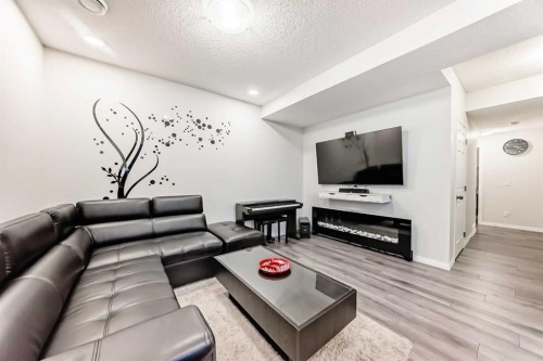 217 Masters Road Se, Calgary, AB - Indoor Photo Showing Living Room With Fireplace