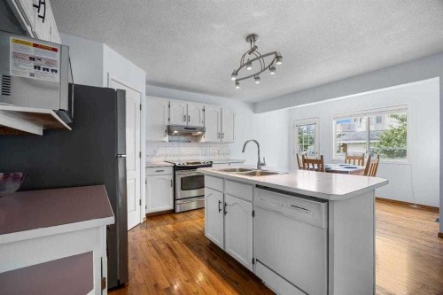 240 Arbour Ridge Way Nw, Calgary, AB - Indoor Photo Showing Kitchen With Double Sink