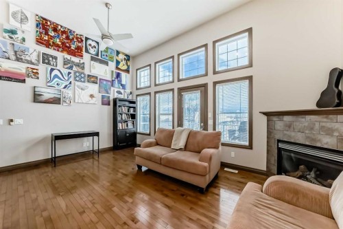 35 Tucker Circle, Okotoks, AB - Indoor Photo Showing Living Room With Fireplace