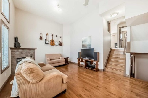 35 Tucker Circle, Okotoks, AB - Indoor Photo Showing Living Room With Fireplace