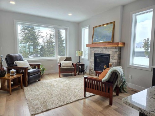 39 Kananaskis Way, Coleman, AB - Indoor Photo Showing Living Room With Fireplace