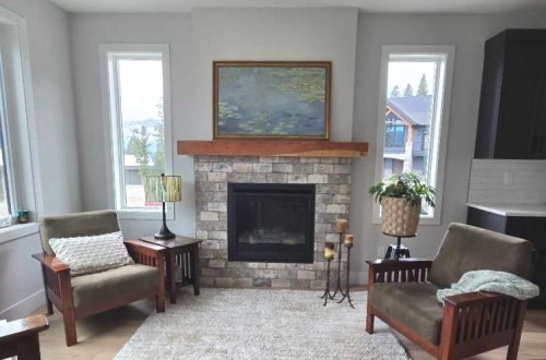 39 Kananaskis Way, Coleman, AB - Indoor Photo Showing Living Room With Fireplace