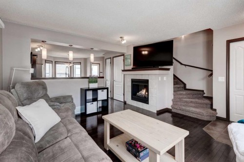 58 Elgin Meadows Gardens Se, Calgary, AB - Indoor Photo Showing Living Room With Fireplace