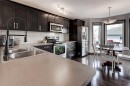 58 Elgin Meadows Gardens Se, Calgary, AB  - Indoor Photo Showing Kitchen With Double Sink With Upgraded Kitchen 