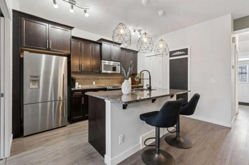 339 Fireside Place, Cochrane, AB - Indoor Photo Showing Kitchen With Upgraded Kitchen