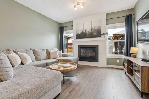 339 Fireside Place, Cochrane, AB - Indoor Photo Showing Living Room With Fireplace