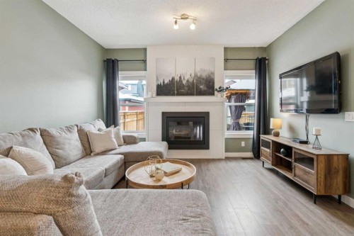 339 Fireside Place, Cochrane, AB - Indoor Photo Showing Living Room With Fireplace