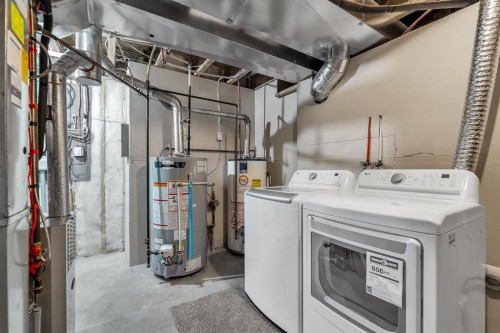 151 Hawkmere View, Chestermere, AB - Indoor Photo Showing Laundry Room