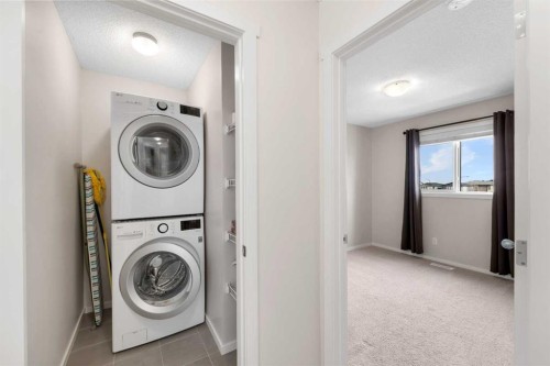 78 Livingston Gate Ne, Calgary, AB - Indoor Photo Showing Laundry Room