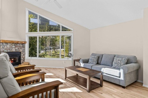 808 Lawrence Grassi Ridge, Canmore, AB - Indoor Photo Showing Living Room With Fireplace