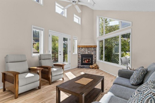 808 Lawrence Grassi Ridge, Canmore, AB - Indoor Photo Showing Living Room With Fireplace
