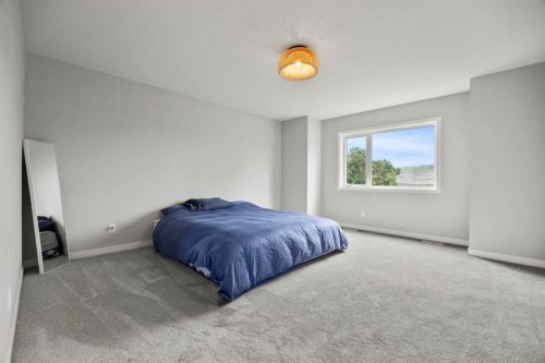335 Sheep River Place, Okotoks, AB - Indoor Photo Showing Bedroom