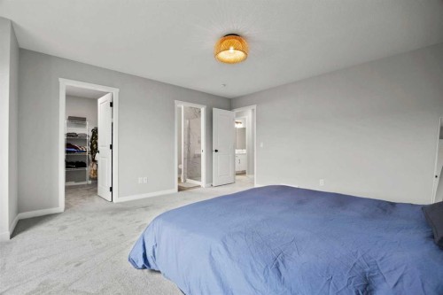 335 Sheep River Place, Okotoks, AB - Indoor Photo Showing Bedroom