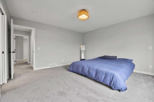 335 Sheep River Place, Okotoks, AB - Indoor Photo Showing Bedroom
