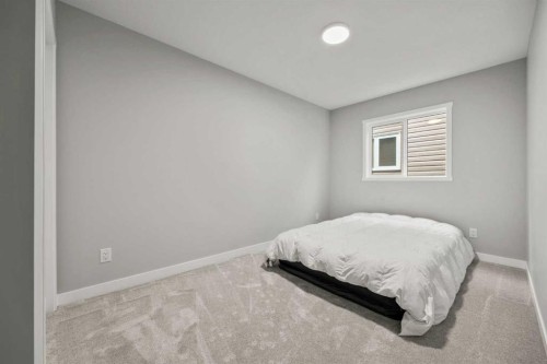 335 Sheep River Place, Okotoks, AB - Indoor Photo Showing Bedroom