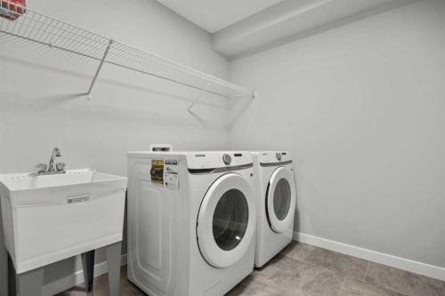 335 Sheep River Place, Okotoks, AB - Indoor Photo Showing Laundry Room