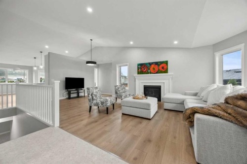 335 Sheep River Place, Okotoks, AB - Indoor Photo Showing Living Room With Fireplace