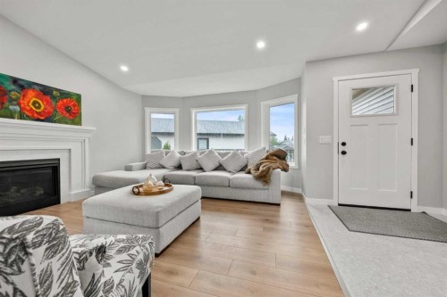 335 Sheep River Place, Okotoks, AB - Indoor Photo Showing Living Room With Fireplace