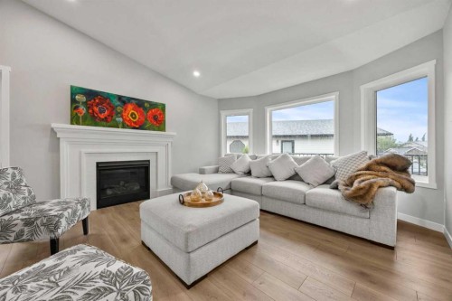 335 Sheep River Place, Okotoks, AB - Indoor Photo Showing Living Room With Fireplace