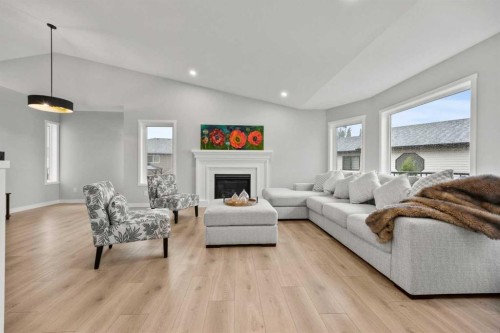 335 Sheep River Place, Okotoks, AB - Indoor Photo Showing Living Room With Fireplace