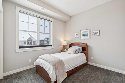 718 Cranbrook Walk Se, Calgary, AB - Indoor Photo Showing Bedroom