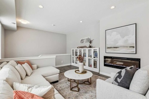 718 Cranbrook Walk Se, Calgary, AB - Indoor Photo Showing Living Room With Fireplace