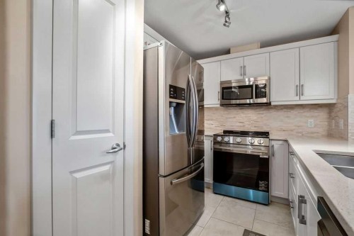 2202-310 Mckenzie Towne Gate Se, Calgary, AB - Indoor Photo Showing Kitchen With Stainless Steel Kitchen With Double Sink