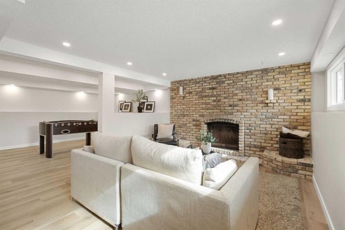 347 Queensland Drive Se, Calgary, AB - Indoor With Fireplace