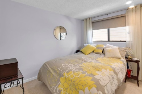 15 Coach Manor Rise Sw, Calgary, AB - Indoor Photo Showing Bedroom