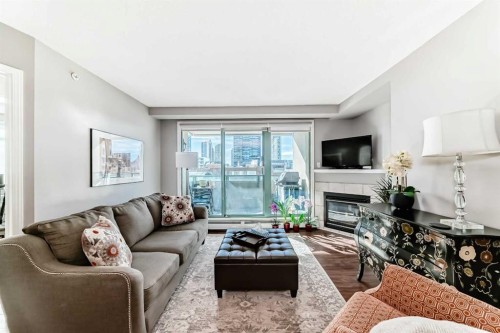 306-1121 6 Avenue Sw, Calgary, AB - Indoor Photo Showing Living Room With Fireplace