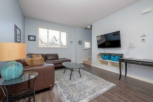 100 Copperstone Villas Se, Calgary, AB - Indoor Photo Showing Living Room