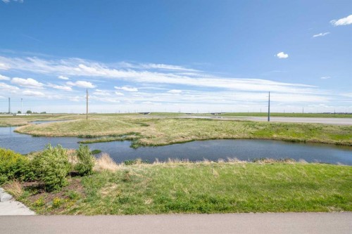 100 Copperstone Villas Se, Calgary, AB - Outdoor With Body Of Water With View
