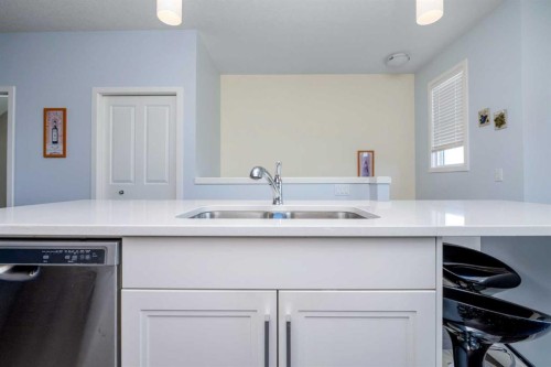 100 Copperstone Villas Se, Calgary, AB - Indoor Photo Showing Kitchen With Double Sink